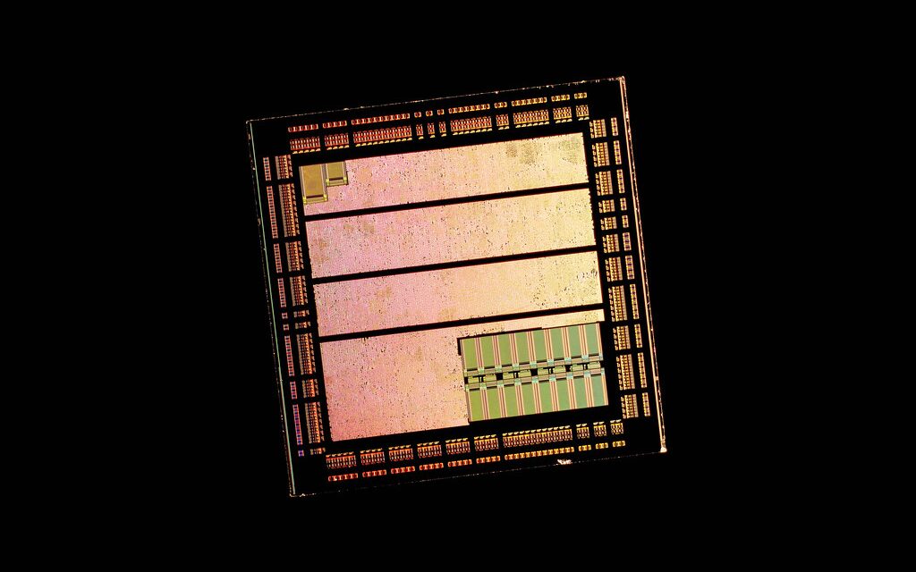 A chip die on a black background